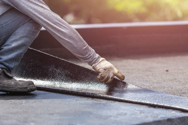 Professional Basement Waterproofing technician working in Montgomery, IN